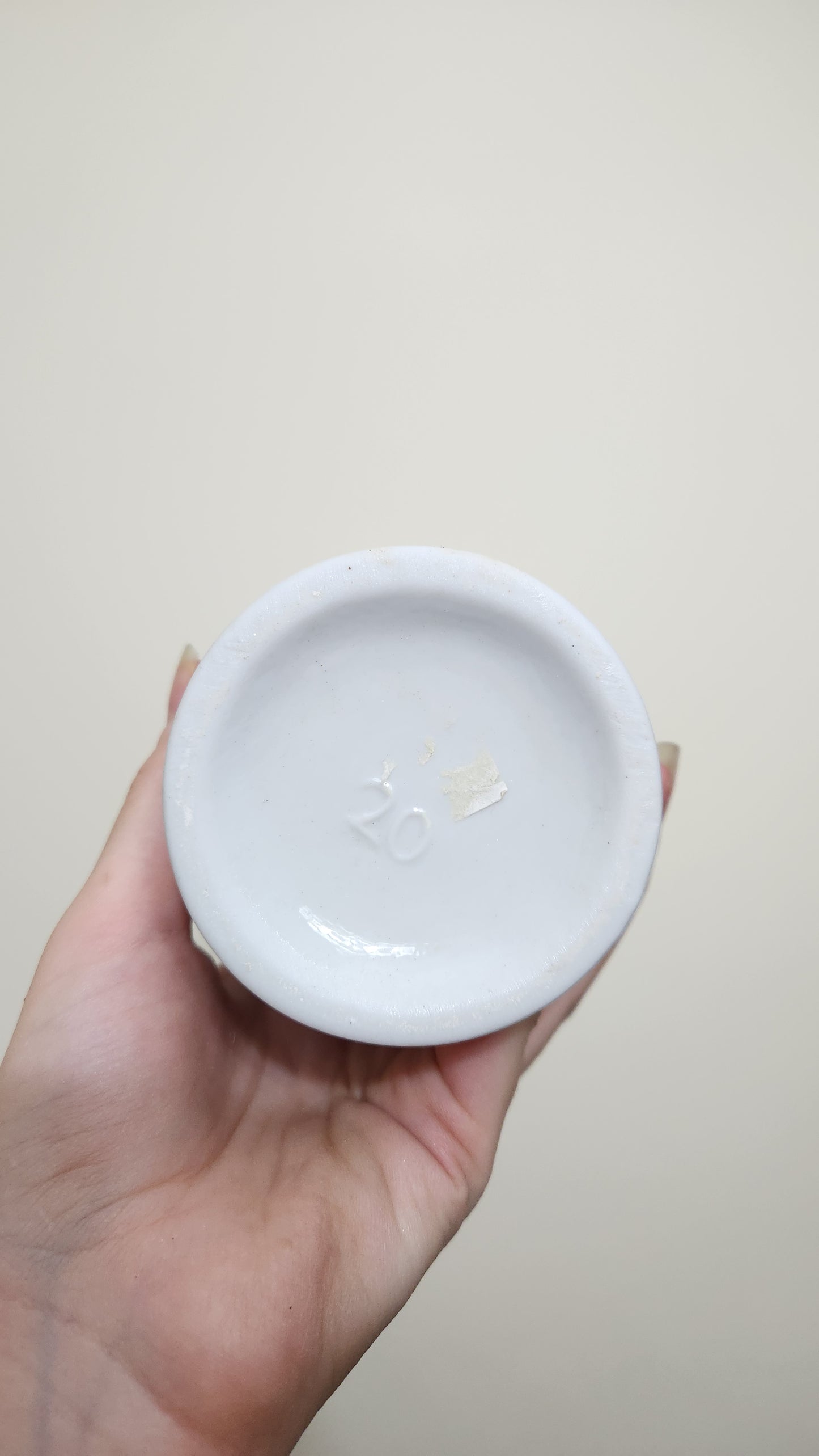 white porcelain vase with a floral and butterfly design