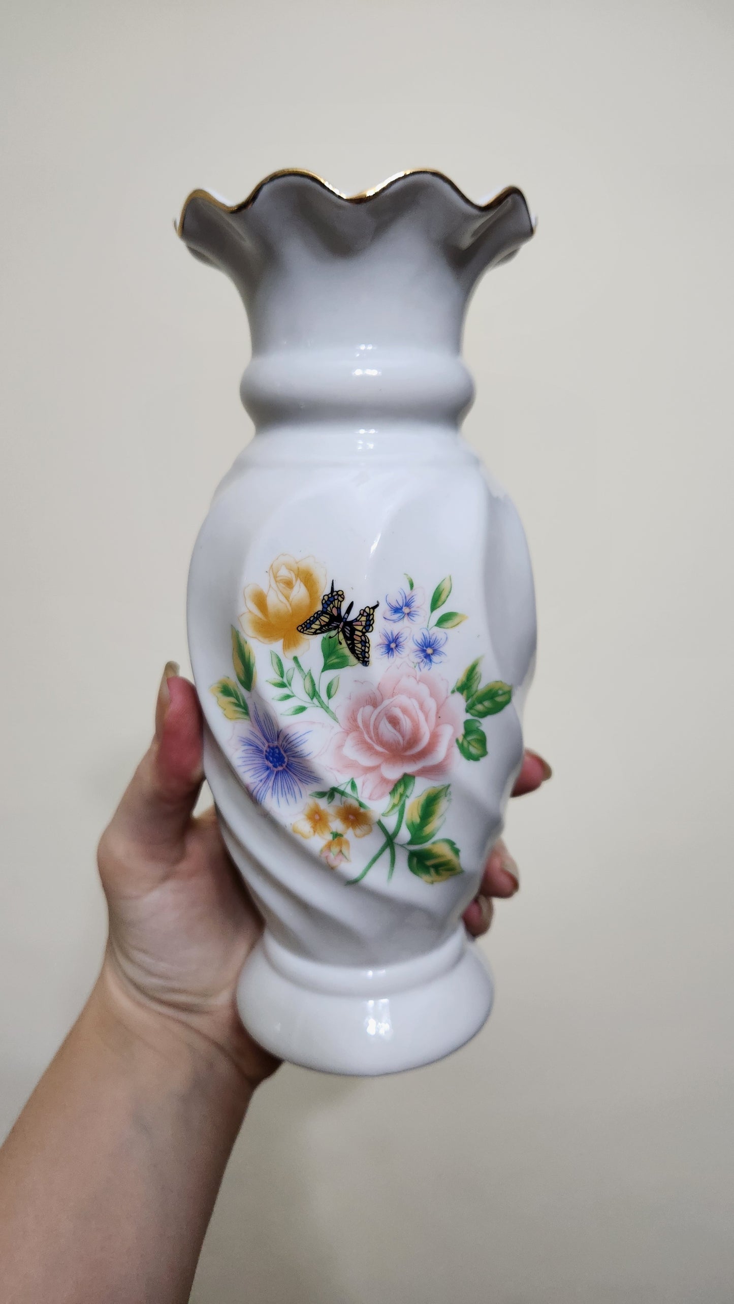 white porcelain vase with a floral and butterfly design