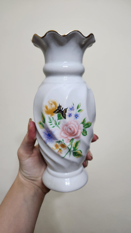 white porcelain vase with a floral and butterfly design