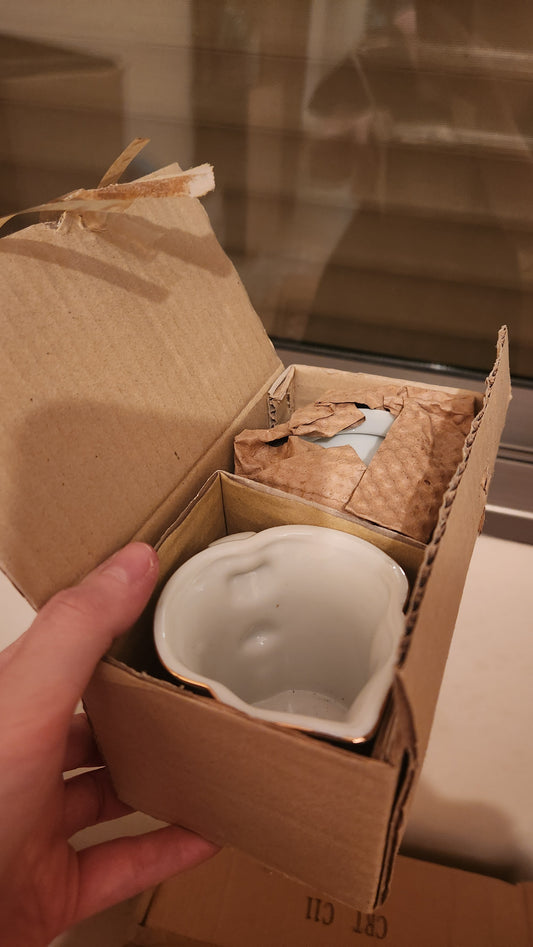set of milk pitcher and a sugar bowl