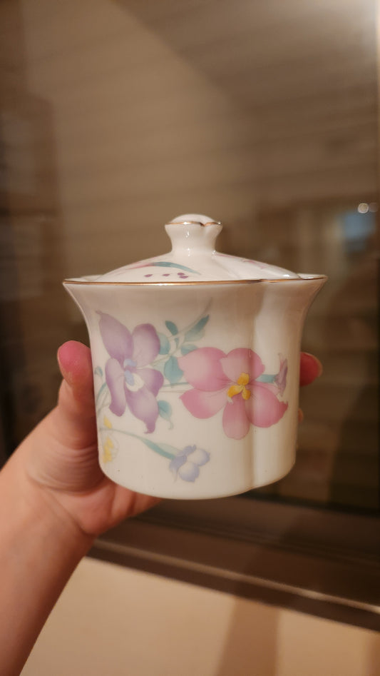 set of milk pitcher and a sugar bowl
