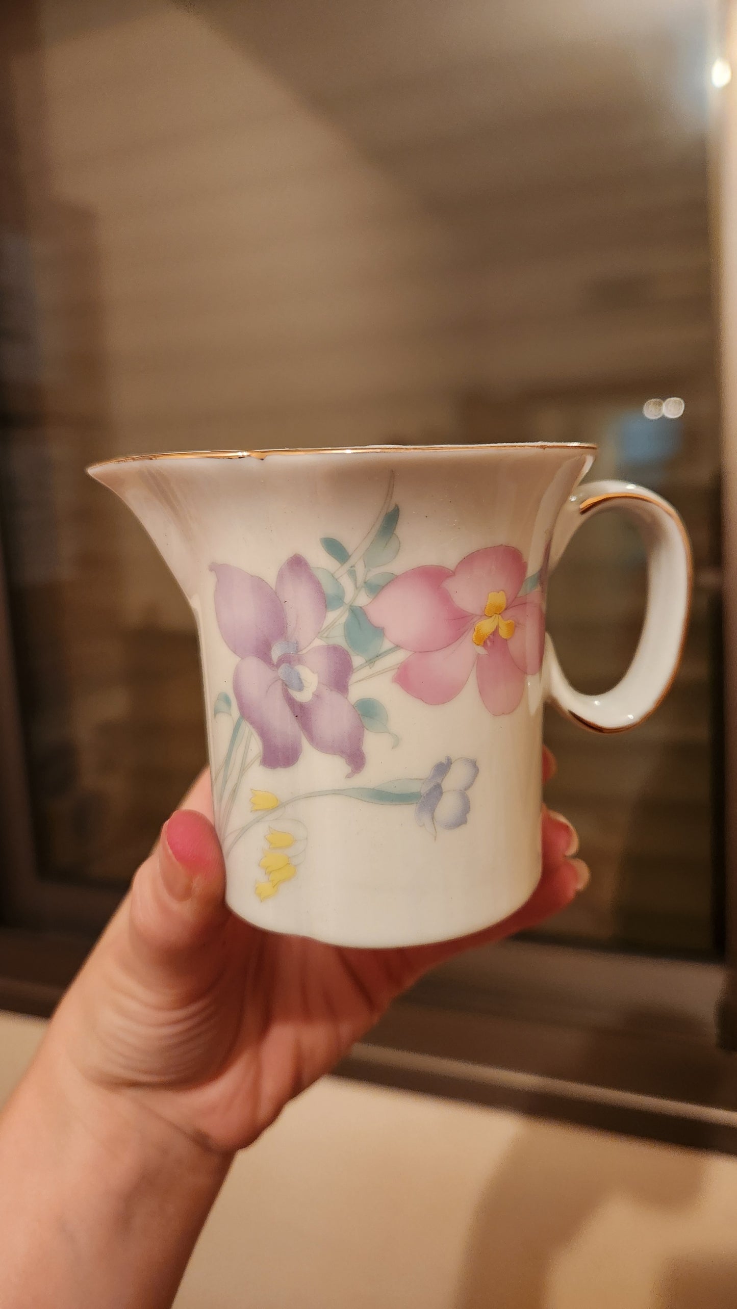 set of milk pitcher and a sugar bowl