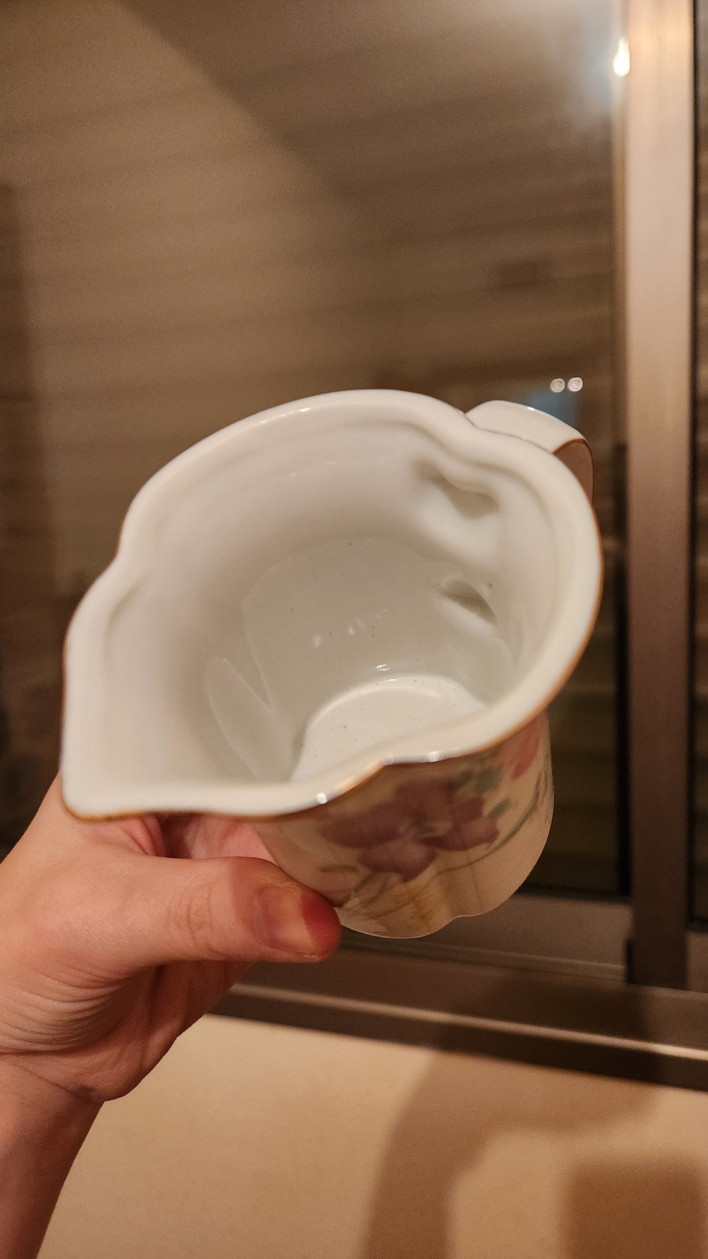 set of milk pitcher and a sugar bowl