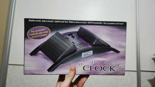 Dome Clock with pop-up speakers