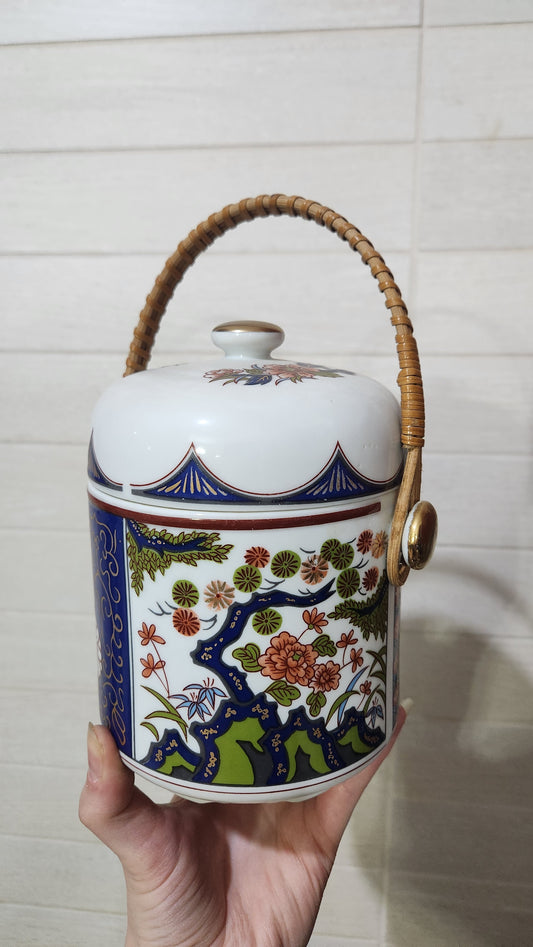 Vintage Japanese Imari-style porcelain teapot with a wicker handle