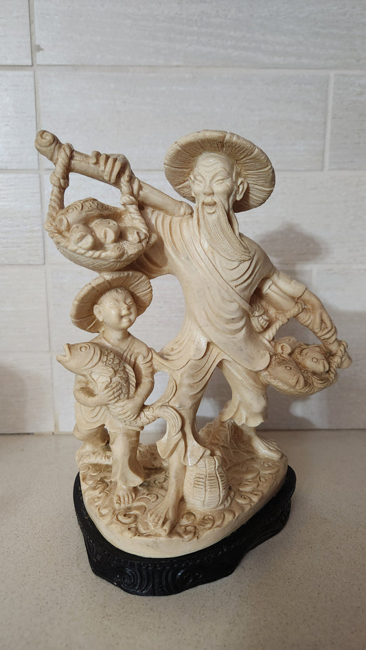 Faux Ivory Resin Figurine of an Oriental Fisherman and Boy with Catch