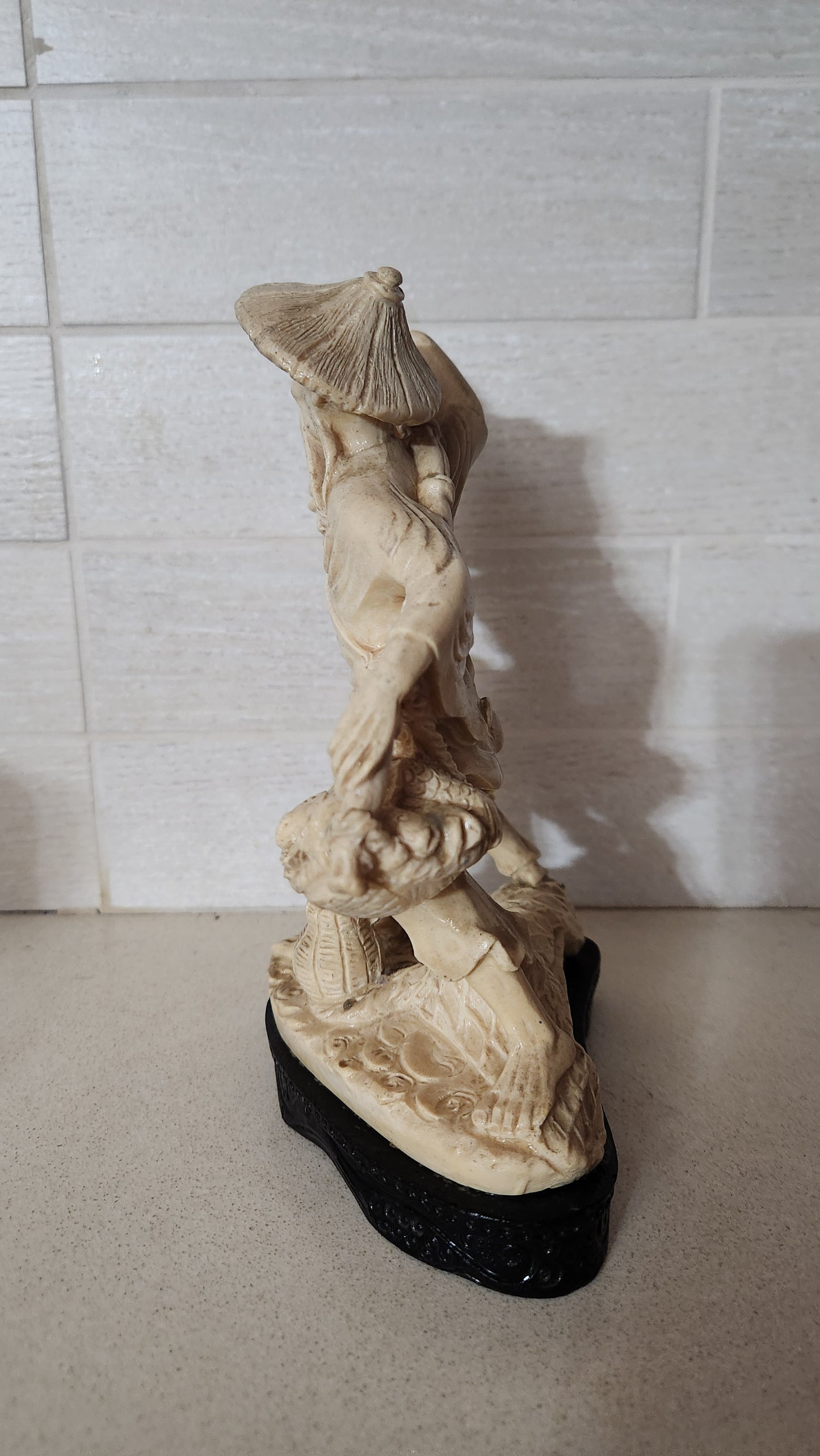 Faux Ivory Resin Figurine of an Oriental Fisherman and Boy with Catch