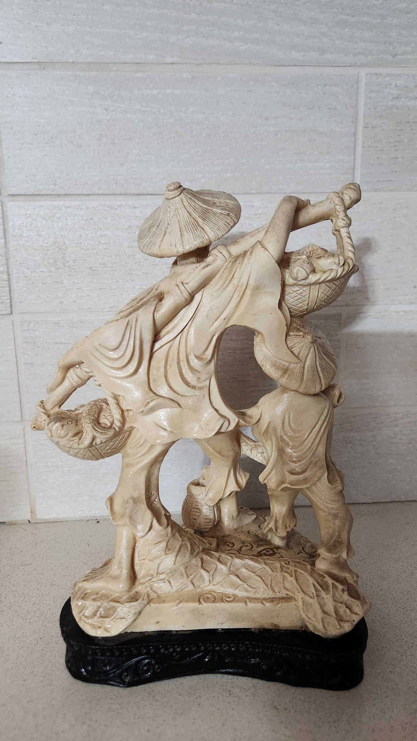 Faux Ivory Resin Figurine of an Oriental Fisherman and Boy with Catch